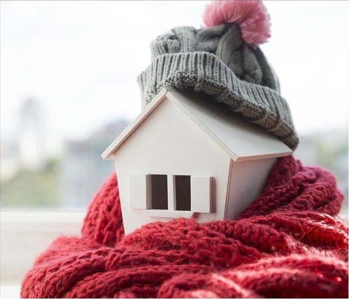 Home wrapped in scarf during winter.